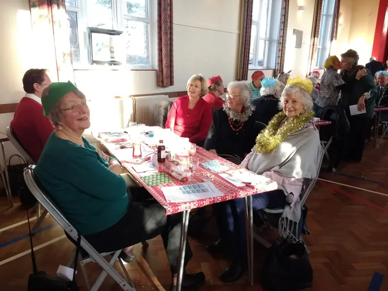 Members around a table at the Christmas party